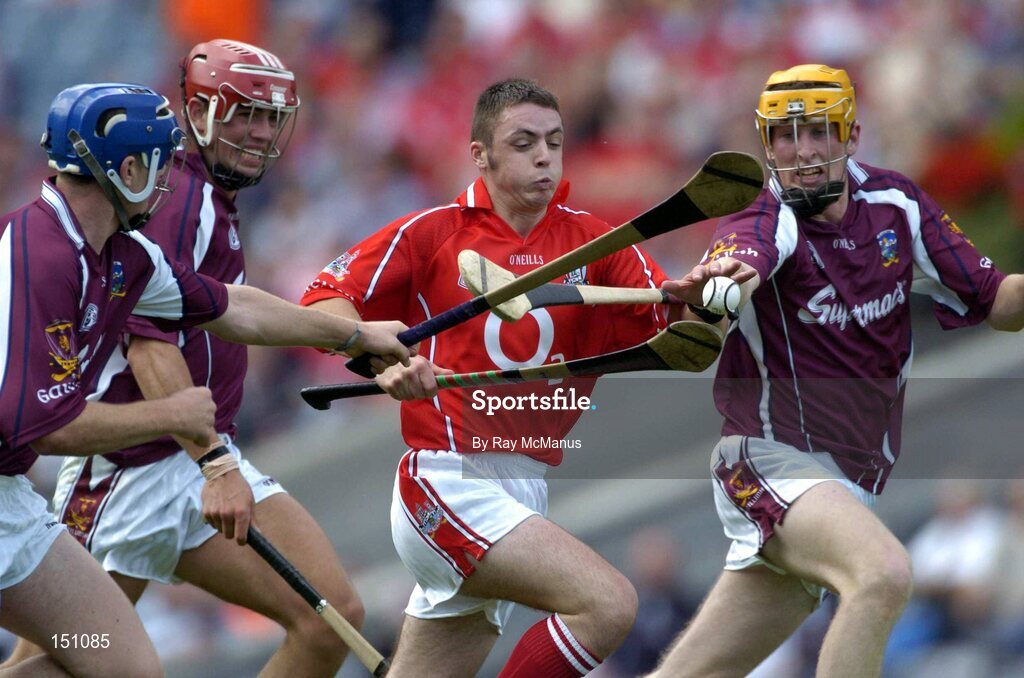 15 August 2004; Ger O'Leary, Cork, is tackled by Galway players, from left, Keith Kilkenny, John Lee and Martin Ryan. Minor Hurling Championship Semi-Final, Galway v Cork, Croke Park, Dublin. Picture credit; Ray McManus / SPORTSFILE