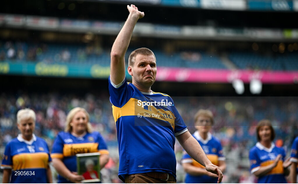 4 August 2024; Colm McGrath, representing his sister Mary McGrath from Emly of the Tipperary team of 1974, who won the first All-Ireland Ladies Senior Football Championship final, during the TG4 All-Ireland Ladies Football Intermediate Championship final match between Leitrim and Tyrone at Croke Park in Dublin. Photo by Seb Daly/Sportsfile