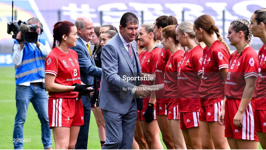 4 August 2024; Uachtarán Cumann Peil Gael na mBan, Mícheál Naughton and Ardstiúrthóir of TG4 Alan Esslemont, behind, is introduced to Louth players by their captian Niamh Rice before the TG4 All-Ireland Ladies Football Junior Championship final match between Fermanagh and Louth at Croke Park in Dublin. Photo by Piaras Ó Mídheach/Sportsfile