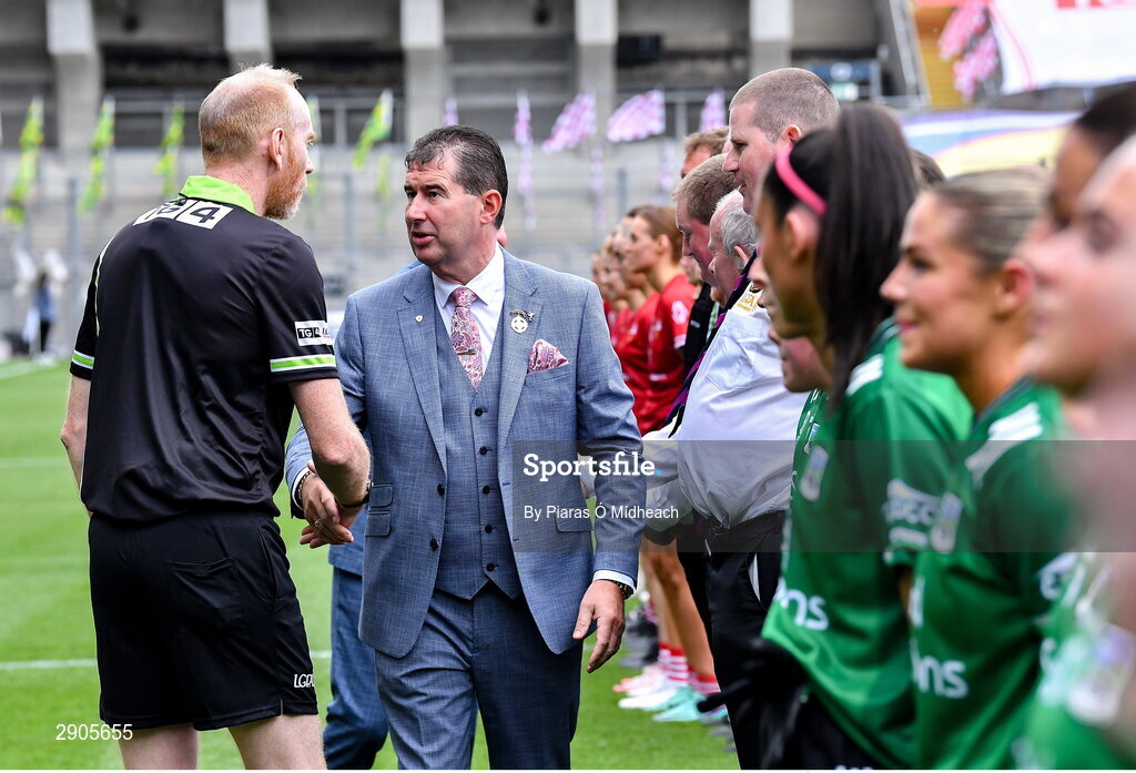 4 August 2024; Uachtarán Cumann Peil Gael na mBan Mícheál Naughton with referee Gerard Canny before the TG4 All-Ireland Ladies Football Junior Championship final match between Fermanagh and Louth at Croke Park in Dublin. Photo by Piaras Ó Mídheach/Sportsfile