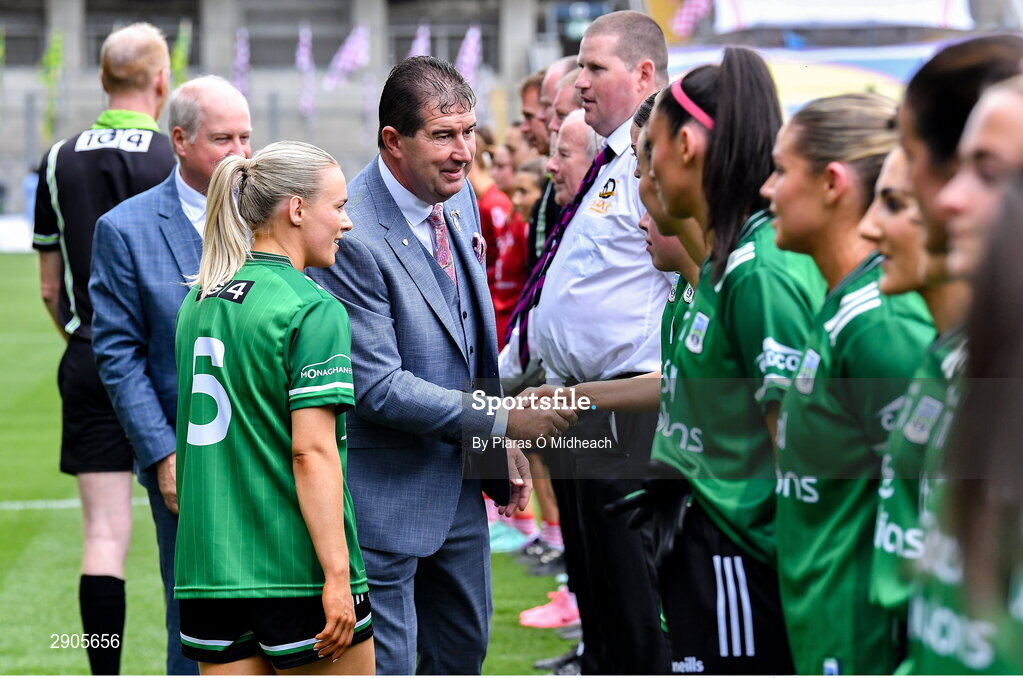 4 August 2024; Uachtarán Cumann Peil Gael na mBan, Mícheál Naughton is introduced to the Fermanagh players by their captain Shannan McQuade before the TG4 All-Ireland Ladies Football Junior Championship final match between Fermanagh and Louth at Croke Park in Dublin. Photo by Piaras Ó Mídheach/Sportsfile