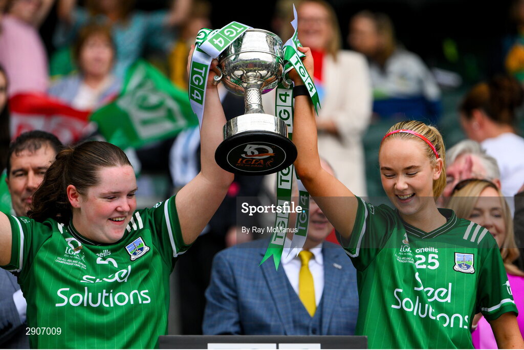 4 August 2024; Fermanagh players Ciara McGarrigle and Eimear McMahon lift the West County Hotel cup after the TG4 All-Ireland Ladies Junior Football Championship final match between Fermanagh and Louth at Croke Park, Dublin. Photo by Ray McManus/Sportsfile
