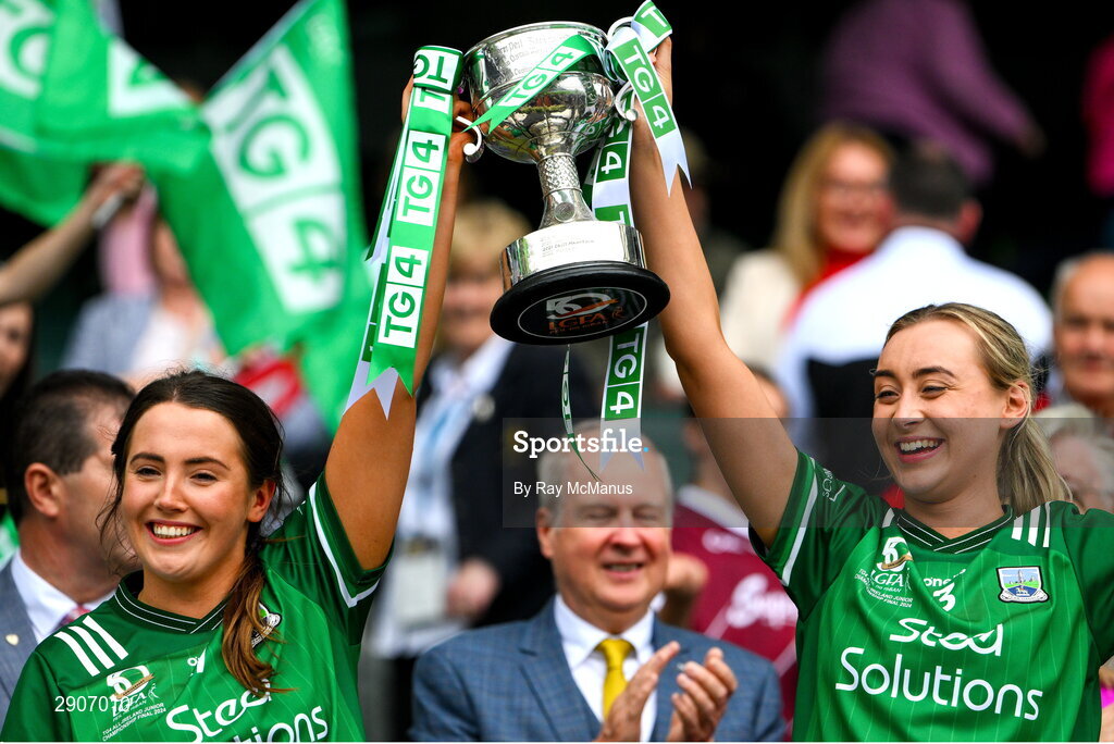 4 August 2024; Fermanagh players Nadine Johnston and Molly McGloin lift the West County Hotel cup after the TG4 All-Ireland Ladies Junior Football Championship final match between Fermanagh and Louth at Croke Park, Dublin. Photo by Ray McManus/Sportsfile