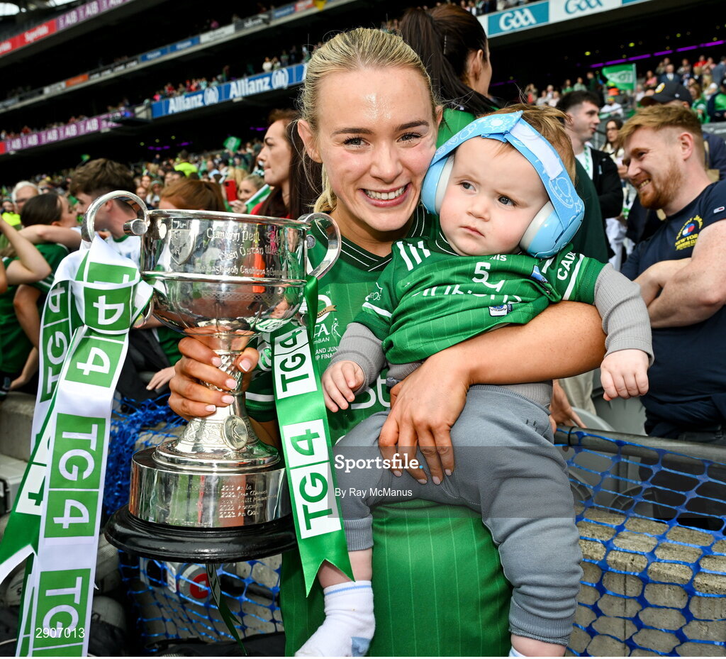 4 August 2024; Bronagh Smyth of Fermanagh holding her nephew James Canavan and the West County Hotel cup after the TG4 All-Ireland Ladies Junior Football Championship final match between Fermanagh and Louth at Croke Park, Dublin. Photo by Ray McManus/Sportsfile