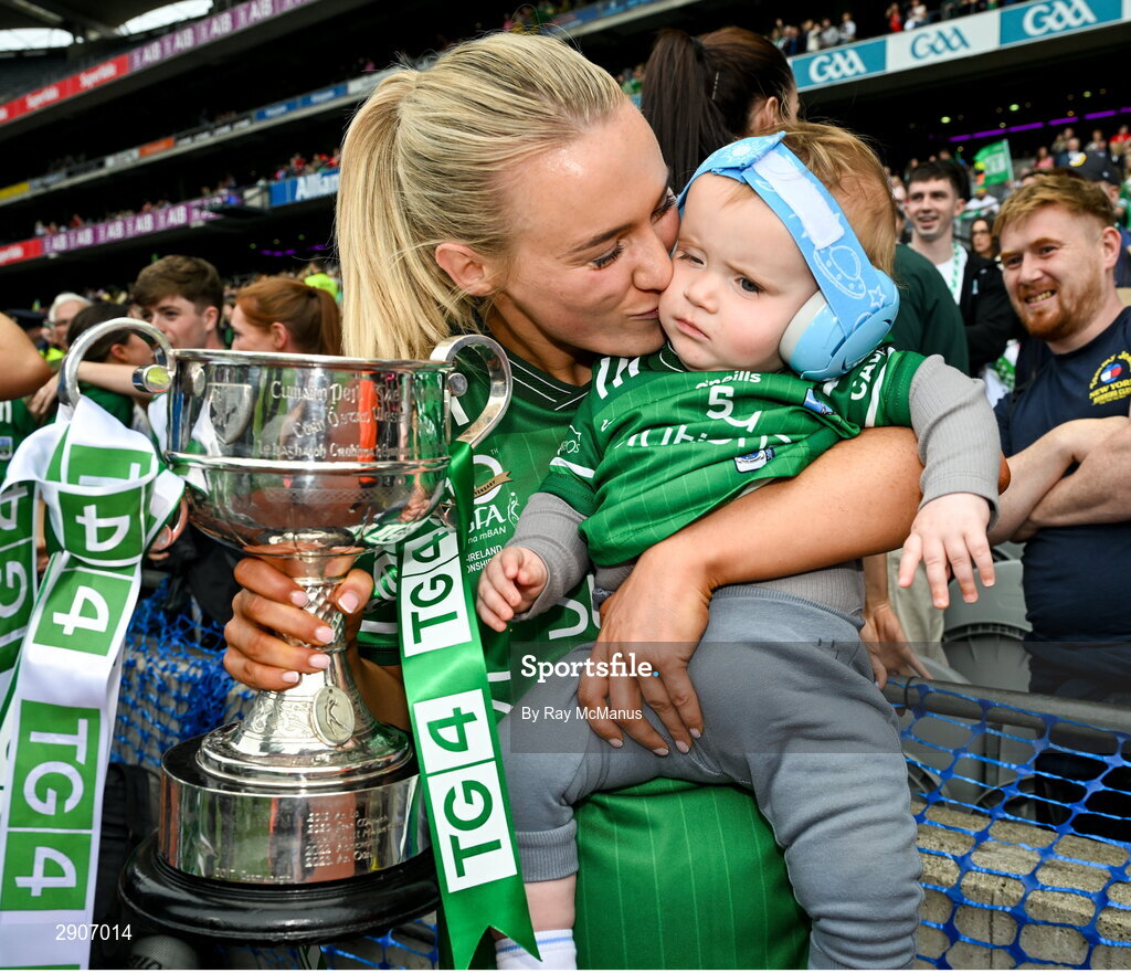 4 August 2024; Bronagh Smyth of Fermanagh holding her nephew James Canavan and the the West County Hotel cup after the TG4 All-Ireland Ladies Junior Football Championship final match between Fermanagh and Louth at Croke Park, Dublin. Photo by Ray McManus/Sportsfile