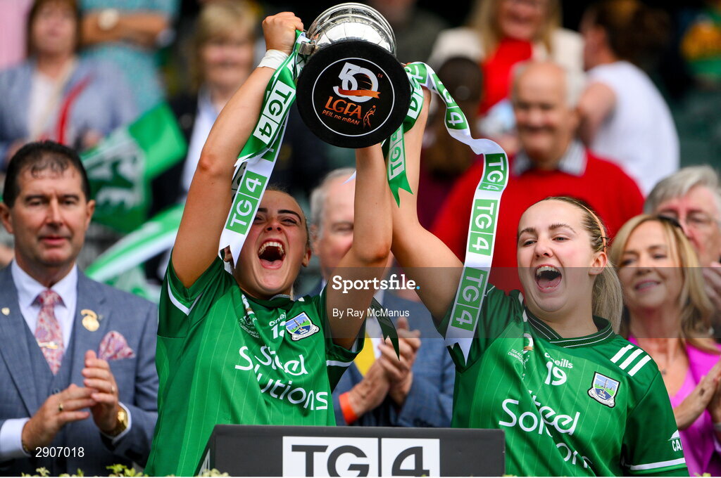 4 August 2024; Fermanagh players Aoife McCabe and Erica Douglas lift the West County Hotel cup after the TG4 All-Ireland Ladies Junior Football Championship final match between Fermanagh and Louth at Croke Park, Dublin. Photo by Ray McManus/Sportsfile