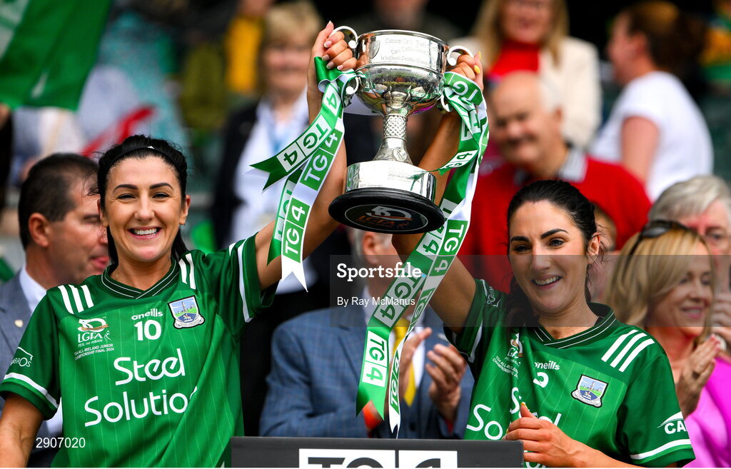 4 August 2024; Fermanagh players Danielle Maguire and Lisa Maguire lift the West County Hotel cup after the TG4 All-Ireland Ladies Junior Football Championship final match between Fermanagh and Louth at Croke Park, Dublin. Photo by Ray McManus/Sportsfile