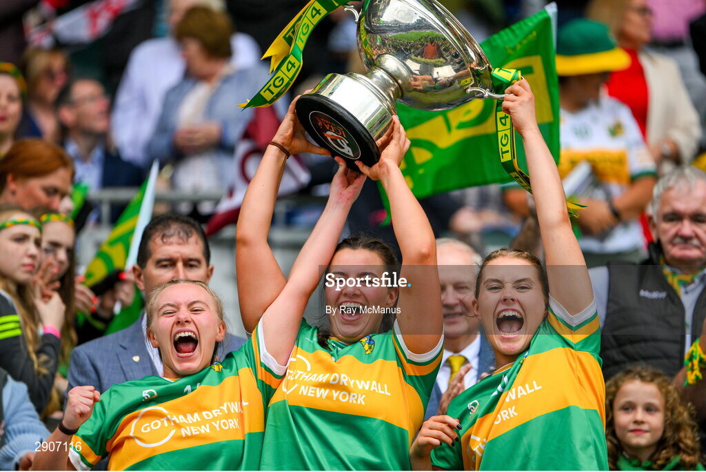 4 August 2024; Leitrim players Síomha Quinn, Éimhín Quinn and Edel Shanley lift the Mary Quinn Memorial cup after the TG4 All-Ireland Ladies Football Intermediate Championship final match between Leitrim and Tyrone at Croke Park, Dublin. Photo by Ray McManus/Sportsfile