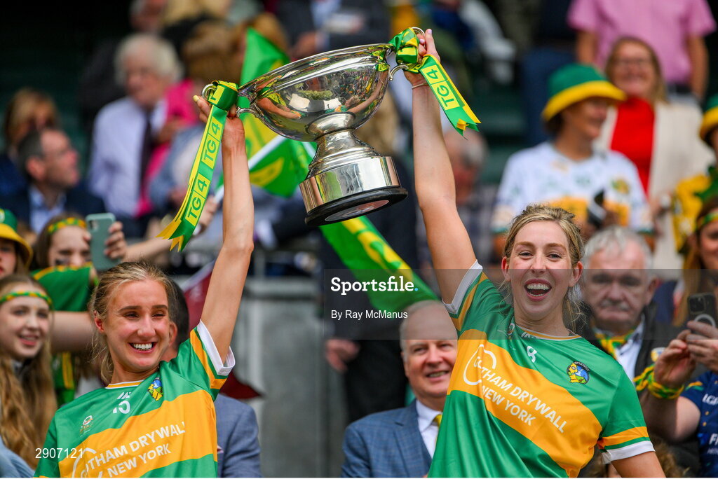 4 August 2024; Leitrim players Áine Redican and Niamh Tighe of Leitrim lift the Mary Quinn Memorial cup after the TG4 All-Ireland Ladies Football Intermediate Championship final match between Leitrim and Tyrone at Croke Park, Dublin. Photo by Ray McManus/Sportsfile