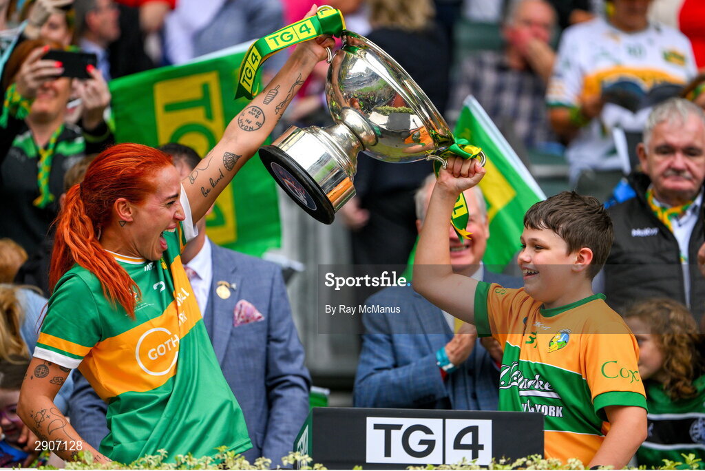 4 August 2024; Charlene Tyrrell of Leitrim and her son Noah lift the Mary Quinn Memorial cup after the TG4 All-Ireland Ladies Football Intermediate Championship final match between Leitrim and Tyrone at Croke Park, Dublin. Photo by Ray McManus/Sportsfile