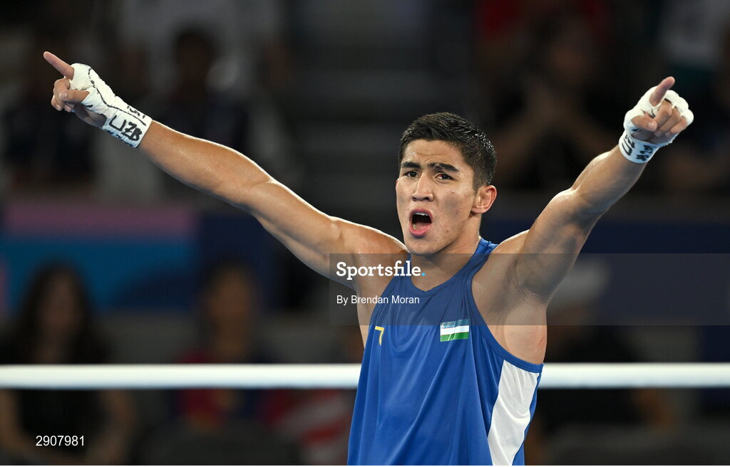 6 August 2024; Asadkhuja Muydinkhujaev of Team Uzbekistan celebrates defeating Omari Jones of Team United States in their men's 71kg semi-final bout at Court Philippe-Chatrier in Roland Garros Stadium during the 2024 Paris Summer Olympic Games in Paris, France. Photo by Brendan Moran/Sportsfile