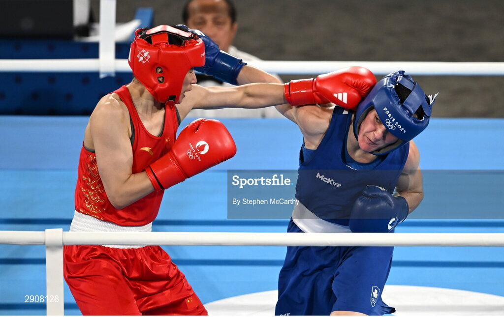 6 August 2024; Kellie Harrington of Team Ireland, right, and Wenlu Yang of Team People's Republic of China during their women's 60kg final bout at Court Philippe-Chatrier in Roland Garros Stadium during the 2024 Paris Summer Olympic Games in Paris, France. Photo by Stephen McCarthy/Sportsfile