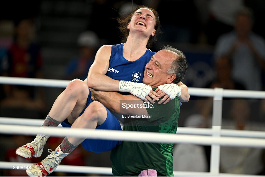 6 August 2024; Kellie Harrington of Team Ireland celebrates with head coach Zaur Antia after defeating Wenlu Yang of Team People's Republic of China in their women's 60kg final bout at Court Philippe-Chatrier in Roland Garros Stadium during the 2024 Paris Summer Olympic Games in Paris, France. Photo by Brendan Moran/Sportsfile
