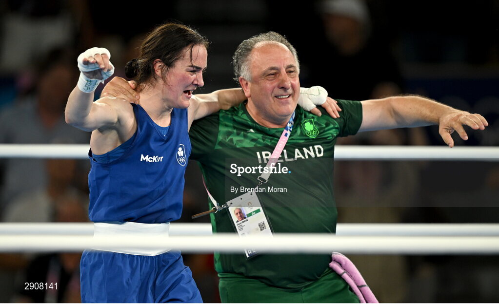 6 August 2024; Kellie Harrington of Team Ireland celebrates with head coach Zaur Antia after defeating Wenlu Yang of Team People's Republic of China in their women's 60kg final bout at Court Philippe-Chatrier in Roland Garros Stadium during the 2024 Paris Summer Olympic Games in Paris, France. Photo by Brendan Moran/Sportsfile