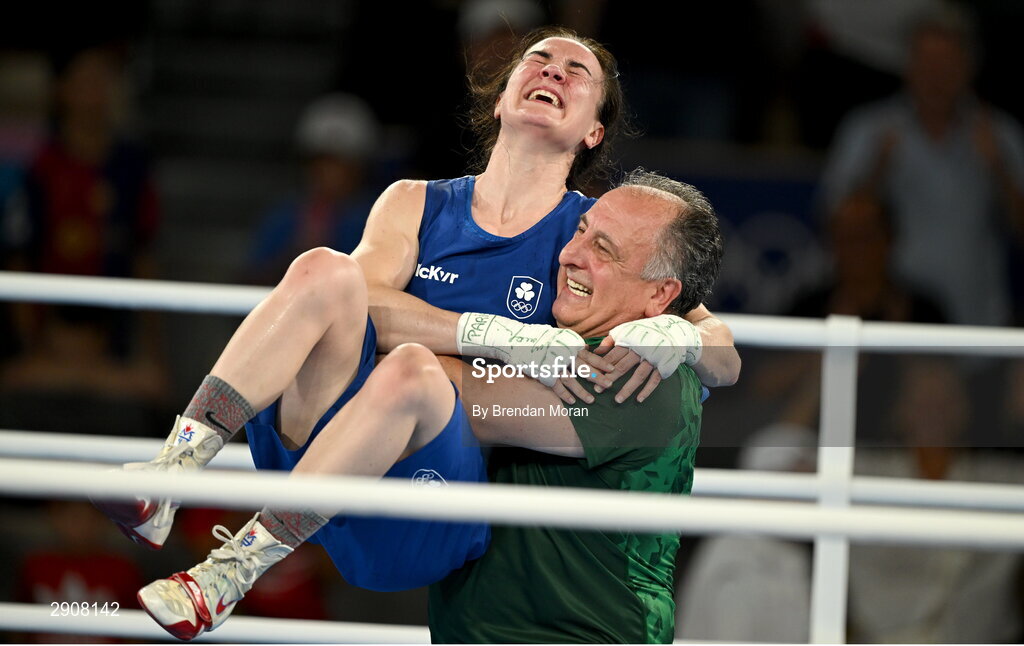 6 August 2024; Kellie Harrington of Team Ireland celebrates with head coach Zaur Antia after defeating Wenlu Yang of Team People's Republic of China in their women's 60kg final bout at Court Philippe-Chatrier in Roland Garros Stadium during the 2024 Paris Summer Olympic Games in Paris, France. Photo by Brendan Moran/Sportsfile