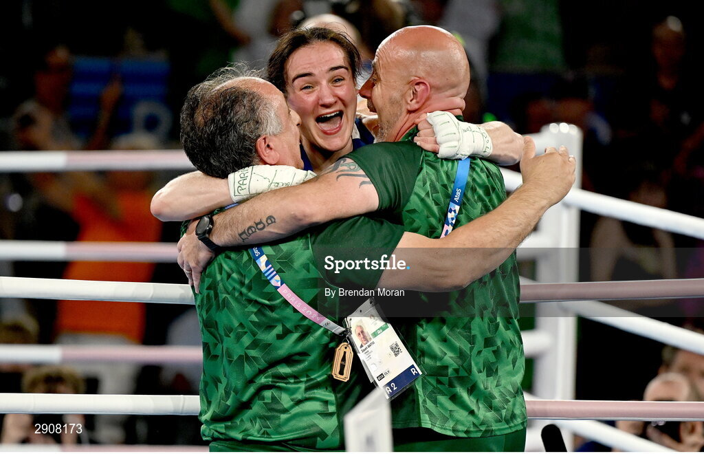 6 August 2024; Kellie Harrington of Team Ireland celebrates with coaches Zaur Antia and Damian Kennedy after defeating Wenlu Yang of Team People's Republic of China in their women's 60kg final bout at Court Philippe-Chatrier in Roland Garros Stadium during the 2024 Paris Summer Olympic Games in Paris, France. Photo by Brendan Moran/Sportsfile