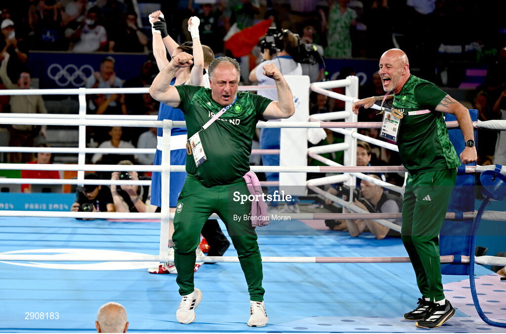 6 August 2024; Zaur Antia, left, and Damian Kennedy, coaches to Kellie Harrington of Team Ireland celebrate as she is declared victorious overWenlu Yang of Team People's Republic of China in their women's 60kg final bout at Court Philippe-Chatrier in Roland Garros Stadium during the 2024 Paris Summer Olympic Games in Paris, France. Photo by Brendan Moran/Sportsfile