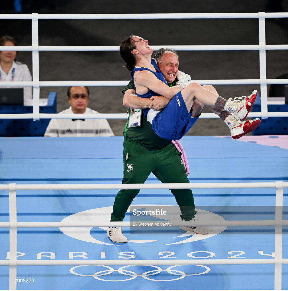 6 August 2024; Kellie Harrington of Team Ireland celebrates with head coach Zaur Antia after defeating Wenlu Yang of Team People's Republic of China in their women's 60kg final bout at Court Philippe-Chatrier in Roland Garros Stadium during the 2024 Paris Summer Olympic Games in Paris, France. Photo by Stephen McCarthy/Sportsfile