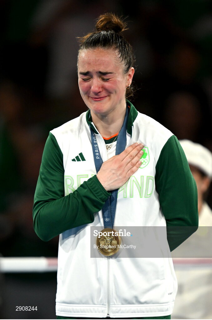 6 August 2024; An emotional Kellie Harrington of Team Ireland during the playing of Amhrán na bhFiann, with her gold medal, after defeating Wenlu Yang of Team People's Republic of China during their women's 60kg final bout at Court Philippe-Chatrier in Roland Garros Stadium during the 2024 Paris Summer Olympic Games in Paris, France. Photo by Stephen McCarthy/Sportsfile