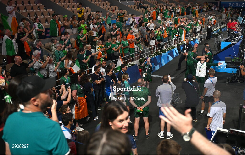 6 August 2024; Kellie Harrington of Team Ireland, right, sings to the supporters after defeating Wenlu Yang of Team People's Republic of China during their women's 60kg final boutat Court Philippe-Chatrier in Roland Garros Stadium during the 2024 Paris Summer Olympic Games in Paris, France. Photo by Stephen McCarthy/Sportsfile