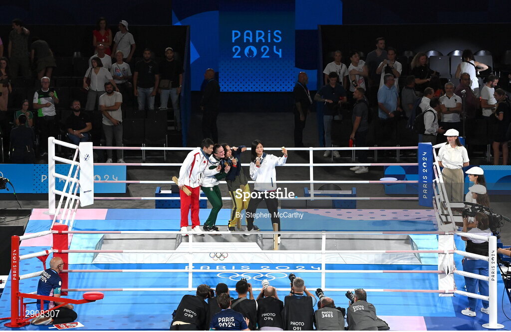 6 August 2024; Women's 60kg medallists, from left, silver medallist Wenlu Yang of Team Peoples's Republic of China, gold medallist Kellie Harrington of Team Ireland, and bronze medallists Beatriz Soares Ferreira of Team Brazil and Shih Yi Wu of Team Chinese Taipei take a selfie during the medal presentation at Court Philippe-Chatrier in Roland Garros Stadium during the 2024 Paris Summer Olympic Games in Paris, France. Photo by Stephen McCarthy/Sportsfile