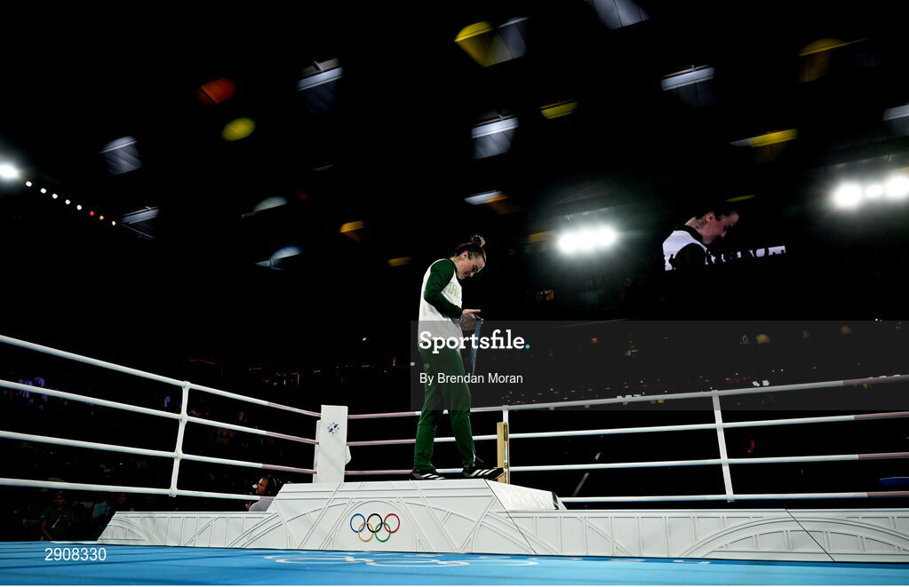 6 August 2024; An emotional Kellie Harrington of Team Ireland looks at her gold medal as she leaves the podium following the medal ceremony after defeating Wenlu Yang of Team People's Republic of China in their women's 60kg final bout at Court Philippe-Chatrier in Roland Garros Stadium during the 2024 Paris Summer Olympic Games in Paris, France. Photo by Brendan Moran/Sportsfile