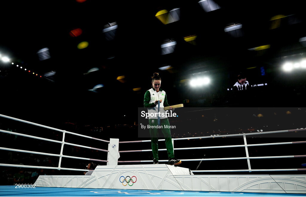 6 August 2024; An emotional Kellie Harrington of Team Ireland looks at her gold medal as she leaves the podium following the medal ceremony after defeating Wenlu Yang of Team People's Republic of China in their women's 60kg final bout at Court Philippe-Chatrier in Roland Garros Stadium during the 2024 Paris Summer Olympic Games in Paris, France. Photo by Brendan Moran/Sportsfile