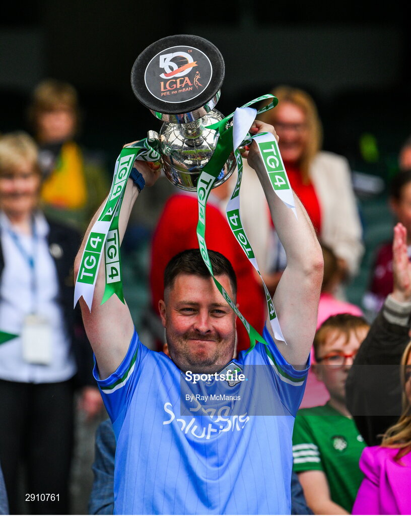 4 August 2024; Fermanagh manager CJ McGourty lifts the cup after their side's victory in the TG4 All-Ireland Ladies Junior Football Championship final match between Fermanagh and Louth at Croke Park, Dublin. Photo by Ray McManus/Sportsfile