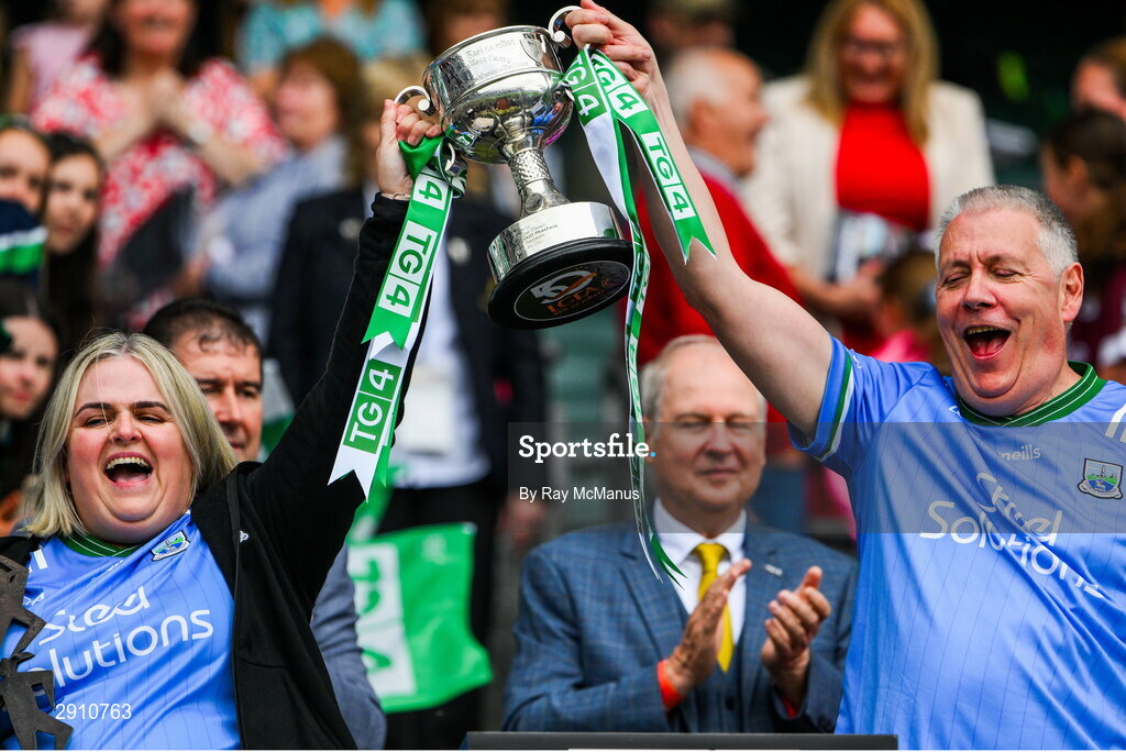 4 August 2024; Fermanagh FLO Geraldine Gleeson and selector/analyst Sean McCartney lift the cup after their side's victory in the TG4 All-Ireland Ladies Junior Football Championship final match between Fermanagh and Louth at Croke Park, Dublin. Photo by Ray McManus/Sportsfile