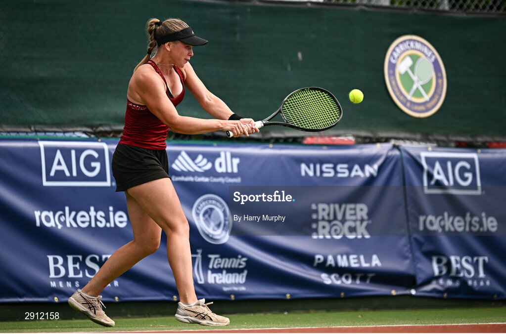 9 August 2024; Ella Haavisto of Finland in action against Megan Davies of Great Britain during their women's singles quarter-final match on day four of the AIG Irish Open Tennis Championships at Carrickmines Croquet Lawn & Tennis Club in Dublin. Photo by Harry Murphy/Sportsfile