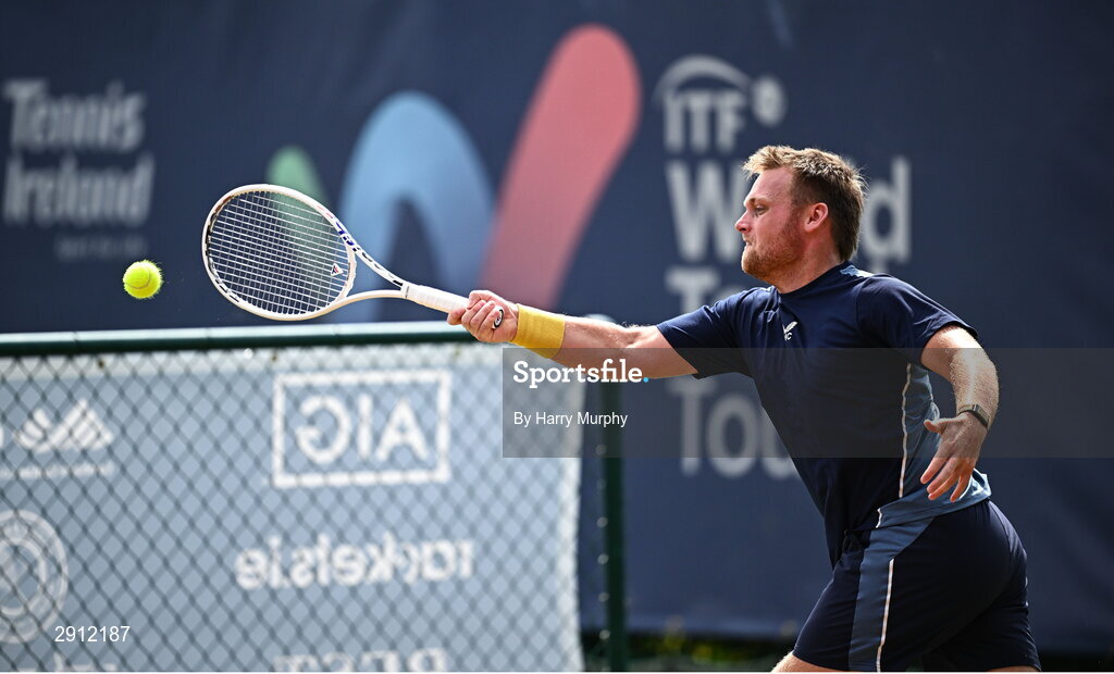 9 August 2024; Finn Bass of Great Britain in action against Brian Bozemoj of Netherlands during their men's singles quarter-final match on day four of the AIG Irish Open Tennis Championships at Carrickmines Croquet Lawn & Tennis Club in Dublin. Photo by Harry Murphy/Sportsfile