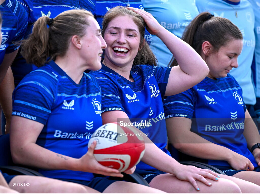 9 August 2024; Molly Boyne, left, shares a joke with team-mate Aoife Moore, centre, during the Leinster Rugby women's jersey presentation at Energia Park in Dublin. Photo by Shauna Clinton/Sportsfile