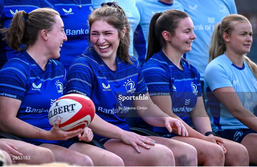 9 August 2024; Molly Boyne, left, shares a joke with team-mate Aoife Moore, centre, during the Leinster Rugby women's jersey presentation at Energia Park in Dublin. Photo by Shauna Clinton/Sportsfile