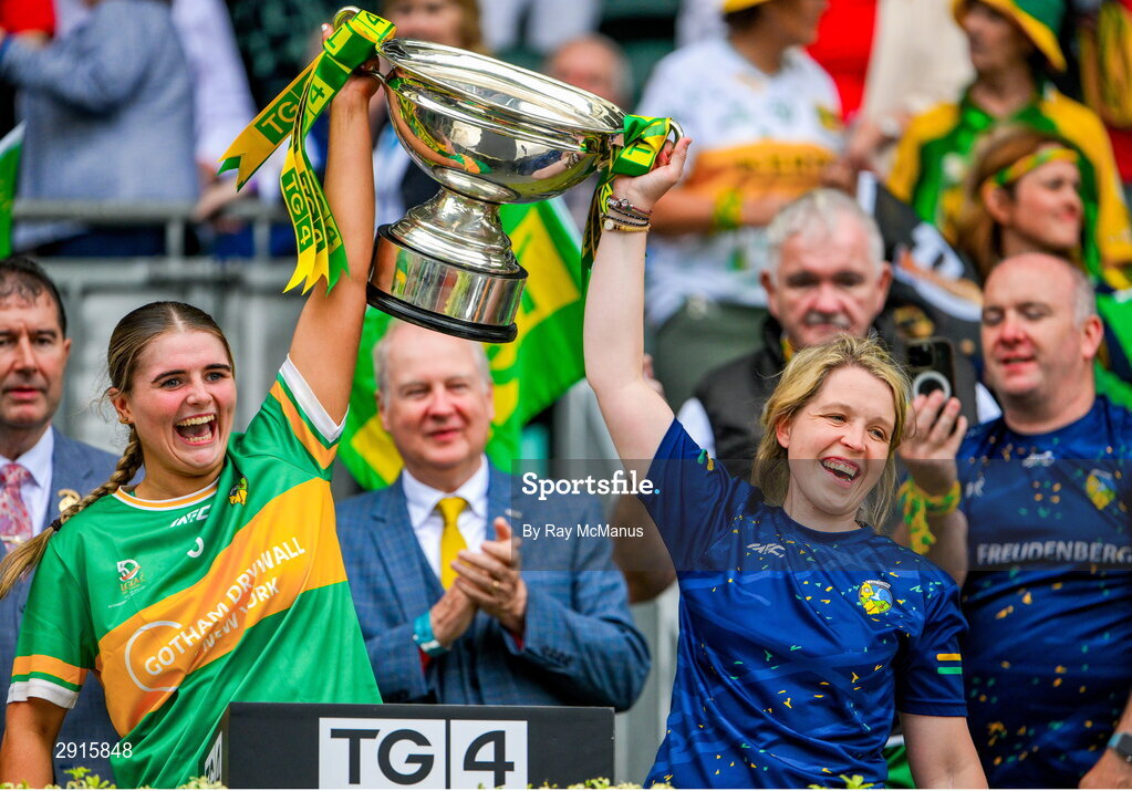 4 August 2024; Sarah Reynolds and Eimear Keenan of Leitrim lift the Mary Quinn Memorial cup after the TG4 All-Ireland Ladies Football Intermediate Championship final match between Leitrim and Tyrone at Croke Park, Dublin. Photo by Ray McManus/Sportsfile