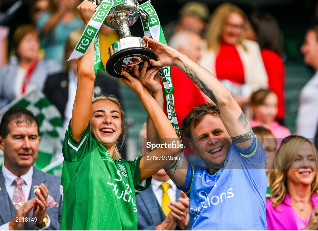 4 August 2024; Caoimhe Gallagher of Fermanagh and her dad Mark lift the West County Hotel cup after the TG4 All-Ireland Ladies Junior Football Championship final match between Fermanagh and Louth at Croke Park, Dublin. Photo by Ray McManus/Sportsfile