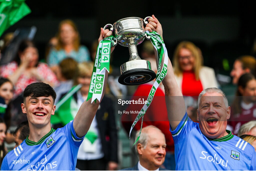 4 August 2024; Ferdia McCartney and Sean McCartney of Fermanagh lift the West County Hotel cup after the TG4 All-Ireland Ladies Junior Football Championship final match between Fermanagh and Louth at Croke Park, Dublin. Photo by Ray McManus/Sportsfile