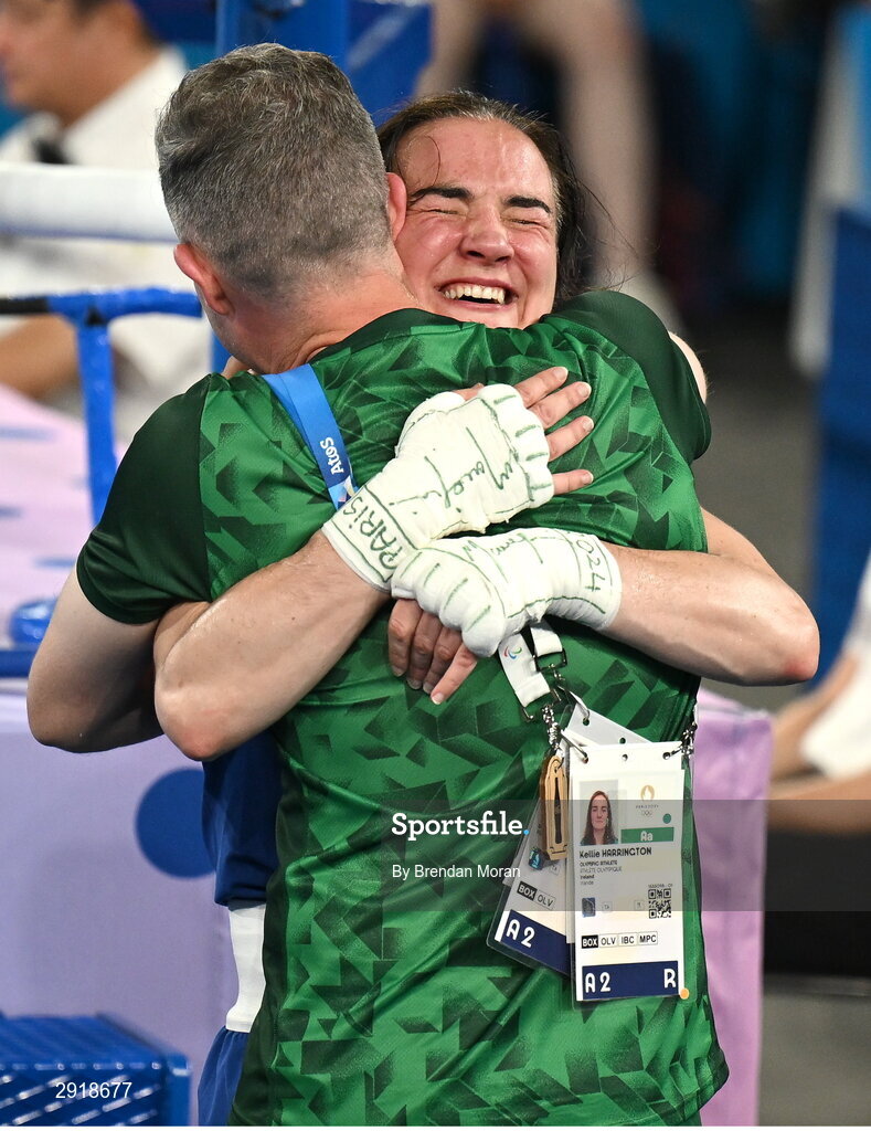 6 August 2024; Kellie Harrington of Team Ireland celebrates with coach James Doyle after defeating Wenlu Yang of Team People's Republic of China in their women's 60kg final bout at Court Philippe-Chatrier in Roland Garros Stadium during the 2024 Paris Summer Olympic Games in Paris, France.  Photo by Brendan Moran/Sportsfile
