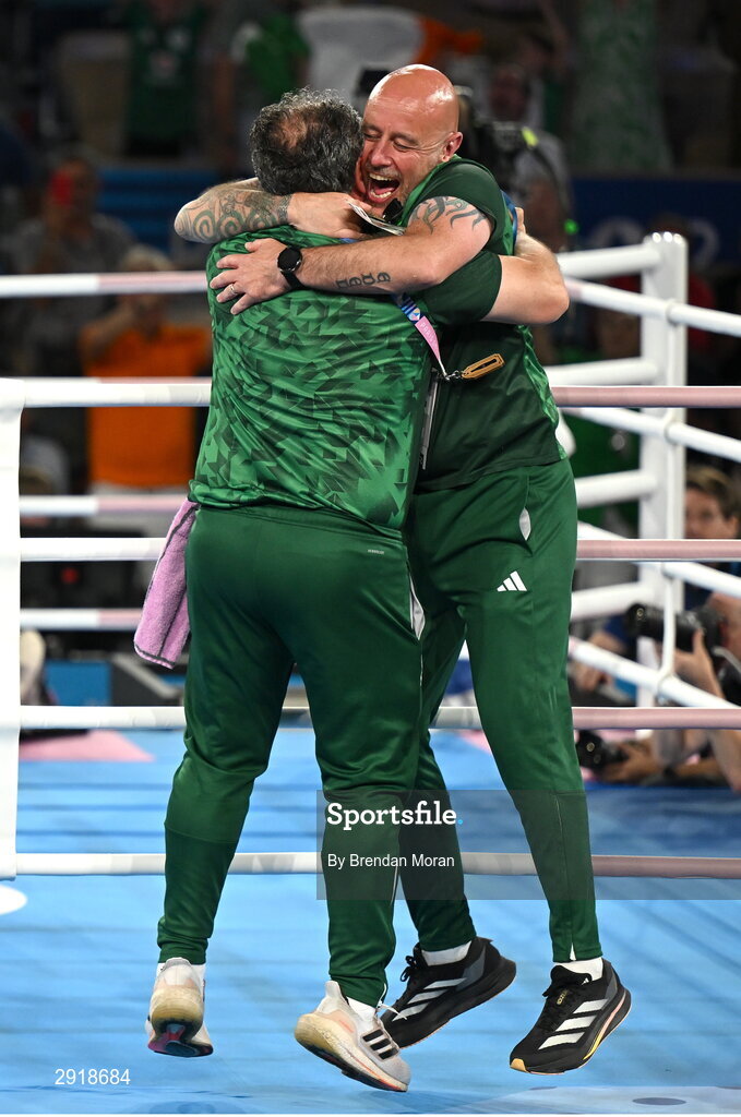 6 August 2024; Team Ireland coaches Zaur Antia, left, and Damian Kennedy celebrate after Kellie Harrington defeated Wenlu Yang of Team People's Republic of China in their women's 60kg final bout at Court Philippe-Chatrier in Roland Garros Stadium during the 2024 Paris Summer Olympic Games in Paris, France. Photo by Brendan Moran/Sportsfile