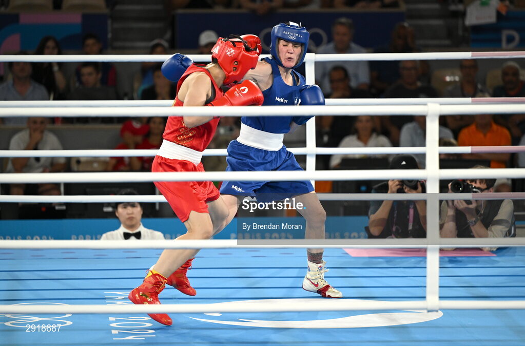 6 August 2024; Kellie Harrington of Team Ireland, right, and Wenlu Yang of Team People's Republic of China during their women's 60kg final bout at Court Philippe-Chatrier in Roland Garros Stadium during the 2024 Paris Summer Olympic Games in Paris, France. Photo by Brendan Moran/Sportsfile