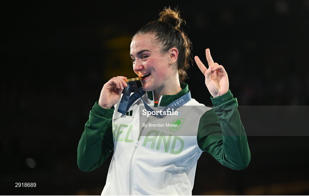 6 August 2024; Kellie Harrington of Team Ireland celebrates with her gold medal after defeating Wenlu Yang of Team People's Republic of China in their women's 60kg final bout  at Court Philippe-Chatrier in Roland Garros Stadium during the 2024 Paris Summer Olympic Games in Paris, France. Photo by Brendan Moran/Sportsfile Photo by Brendan Moran/Sportsfile