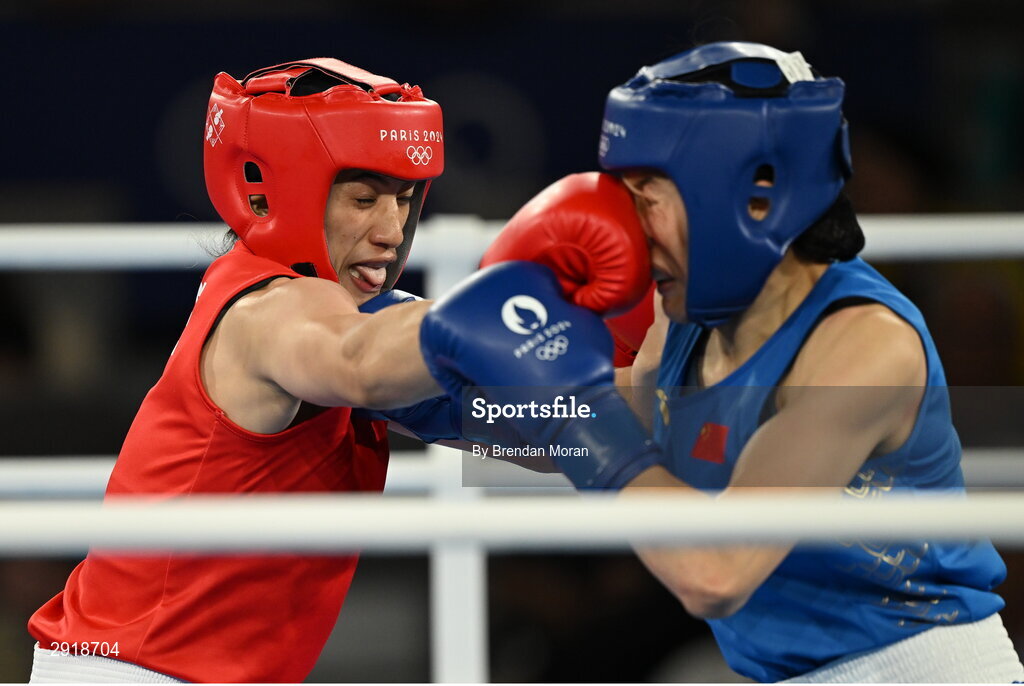 6 August 2024; Nien Chin Chen of Team Chinese Taipei, left, and Liu Yang of Team People's Republic Of China at Court Philippe-Chatrier in Roland Garros Stadium during the 2024 Paris Summer Olympic Games in Paris, France. Photo by Brendan Moran/Sportsfile