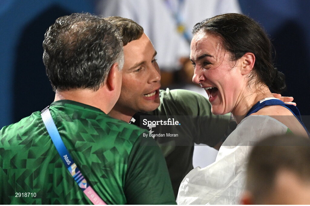 6 August 2024; Kellie Harrington of Team Ireland, right, and coach Zaur Antia meet former boxer Carl Frampton after her women's 60kg final bout at Court Philippe-Chatrier in Roland Garros Stadium during the 2024 Paris Summer Olympic Games in Paris, France. Photo by Brendan Moran/Sportsfile Photo by Brendan Moran/Sportsfile