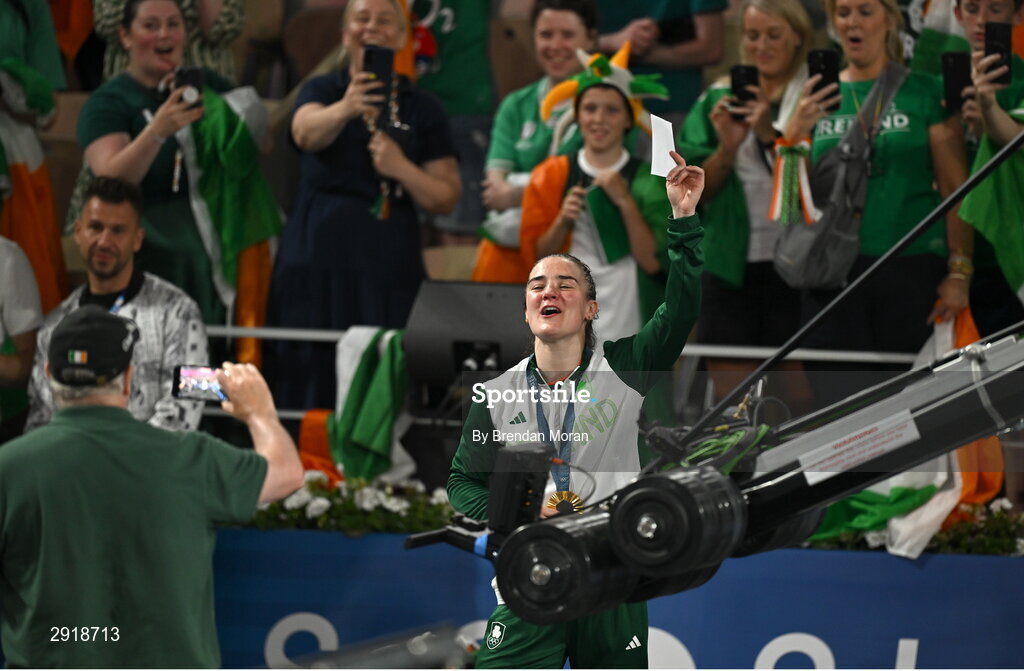 6 August 2024; Kellie Harrington of Team Ireland sings the song 'Grace' with her supporters after defeating Wenlu Yang of Team People's Republic of China in their women's 60kg final bout at Court Philippe-Chatrier in Roland Garros Stadium during the 2024 Paris Summer Olympic Games in Paris, France. Photo by Brendan Moran/Sportsfile