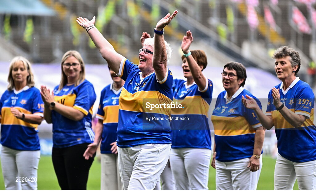4 August 2024; Eleanor Carroll, from Ardfinnan, of the Tipperary team of 1974, who won the first All-Ireland Ladies Senior Football Championship final, as they are introduced to the crowd at half-time during the TG4 All-Ireland Ladies Football Intermediate Championship final match between Leitrim and Tyrone at Croke Park in Dublin. Photo by Piaras Ó Mídheach/Sportsfile
