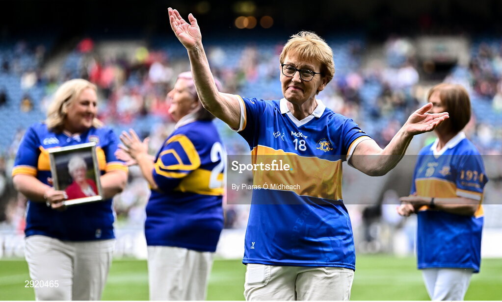 4 August 2024; Mary Burke, from Emly, of the Tipperary team of 1974, who won the first All-Ireland Ladies Senior Football Championship final, as they are introduced to the crowd at half-time during the TG4 All-Ireland Ladies Football Intermediate Championship final match between Leitrim and Tyrone at Croke Park in Dublin. Photo by Piaras Ó Mídheach/Sportsfile