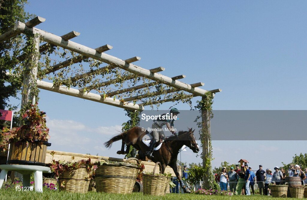 17 August 2004; Ireland's Niall Griffin, on Lorgaine, clears the basket fence during the Cross Country discipline of the 3 Day Eventing Competition. Markopoulo Olympic Equestrian Centre. Games of the XXVIII Olympiad, Athens Summer Olympics Games 2004, Athens, Greece. Picture credit; Brendan Moran / SPORTSFILE
