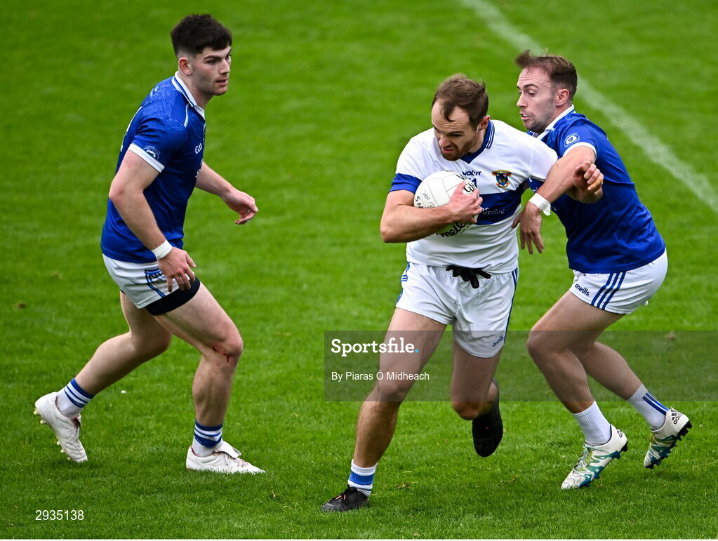 8 September 2024; Gavin Burke of St Vincent's in action against Kevin Gilmore, right, and Eoghan O'Connor Flanagan of Skerries Harps during the Dublin County Senior 1 Club Football Championship Group 4 match between Skerries Harps and St Vincent's at Parnell Park in Dublin. Photo by Piaras Ó Mídheach/Sportsfile