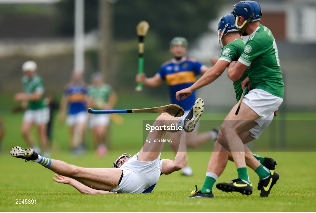 22 September 2024; Diarmaid Byrnes of Patrickswell is fouled by Pierce Connery of Kilmallock during the Limerick County Senior Club Hurling Championship Group 1 match between Patrickswell and Kilmallock at Mick Neville Park in Rathkeale, Limerick. Photo by Tom Beary/Sportsfile