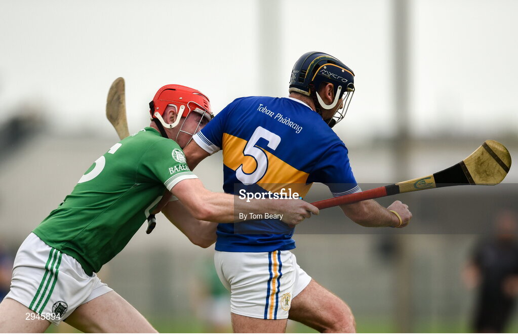 22 September 2024; Mark Carmody of Patrickswell is tackled by Phelim O'Reilly of Kilmallock during the Limerick County Senior Club Hurling Championship Group 1 match between Patrickswell and Kilmallock at Mick Neville Park in Rathkeale, Limerick. Photo by Tom Beary/Sportsfile