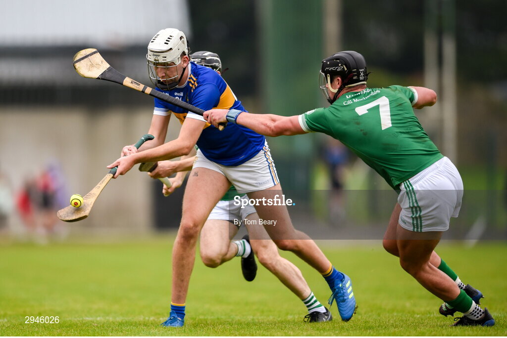 22 September 2024; Josh Carey of Patrickswell is tackled by Paddy O'Loughlin of Kilmallock during the Limerick County Senior Club Hurling Championship Group 1 match between Patrickswell and Kilmallock at Mick Neville Park in Rathkeale, Limerick. Photo by Tom Beary/Sportsfile